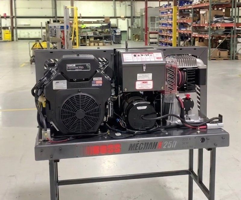 BOSS Mechanx 250 combo compressor and generator unit staged on the warehouse floor