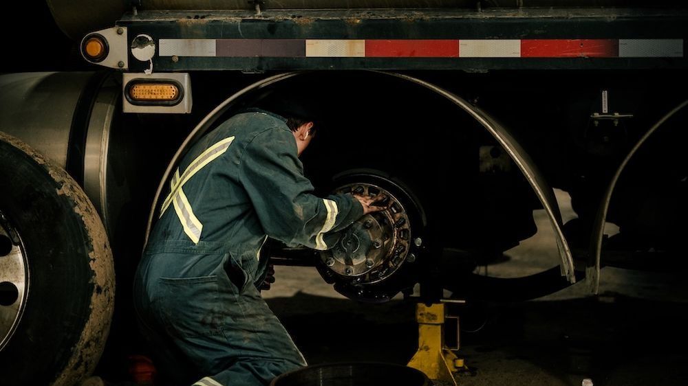 Mach 6 technician servicing a vacuum tanker unit for a waste and recycling fleet