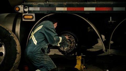 Mach 6 technician working on a wheel end in the shop