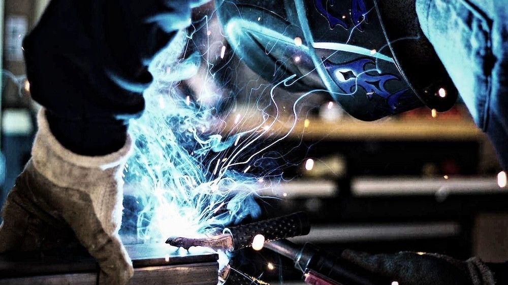 Welding arc and sparks during structural fabrication work at Mach 6